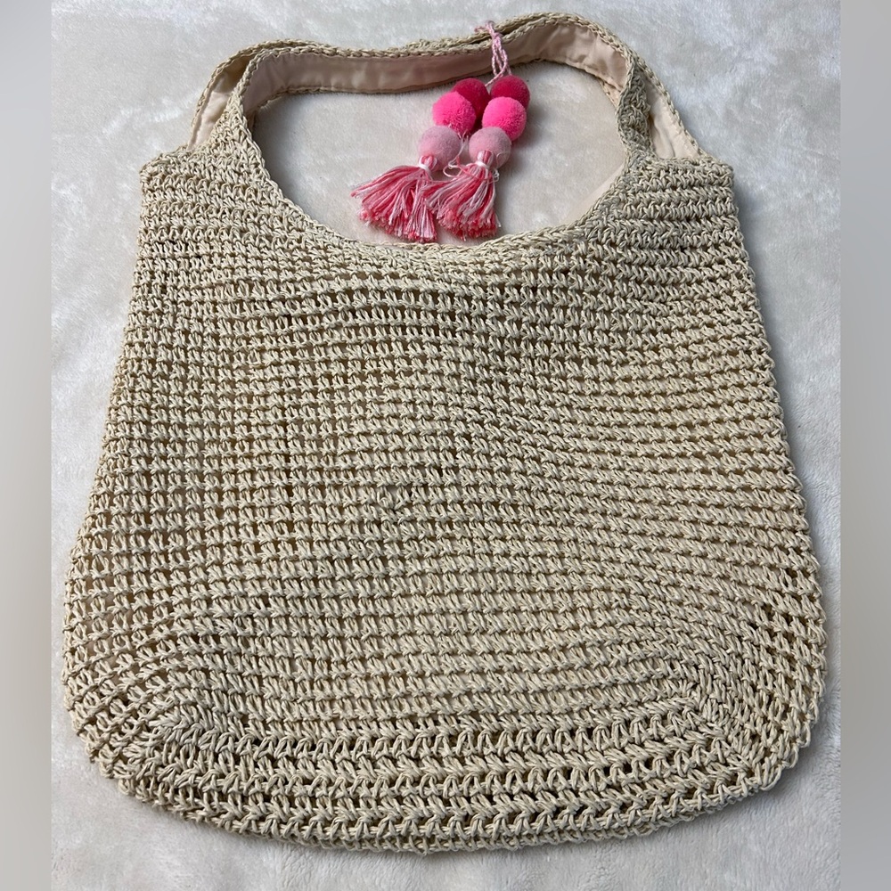 Beige Woven Crochet style Handbag with Pink Tassels